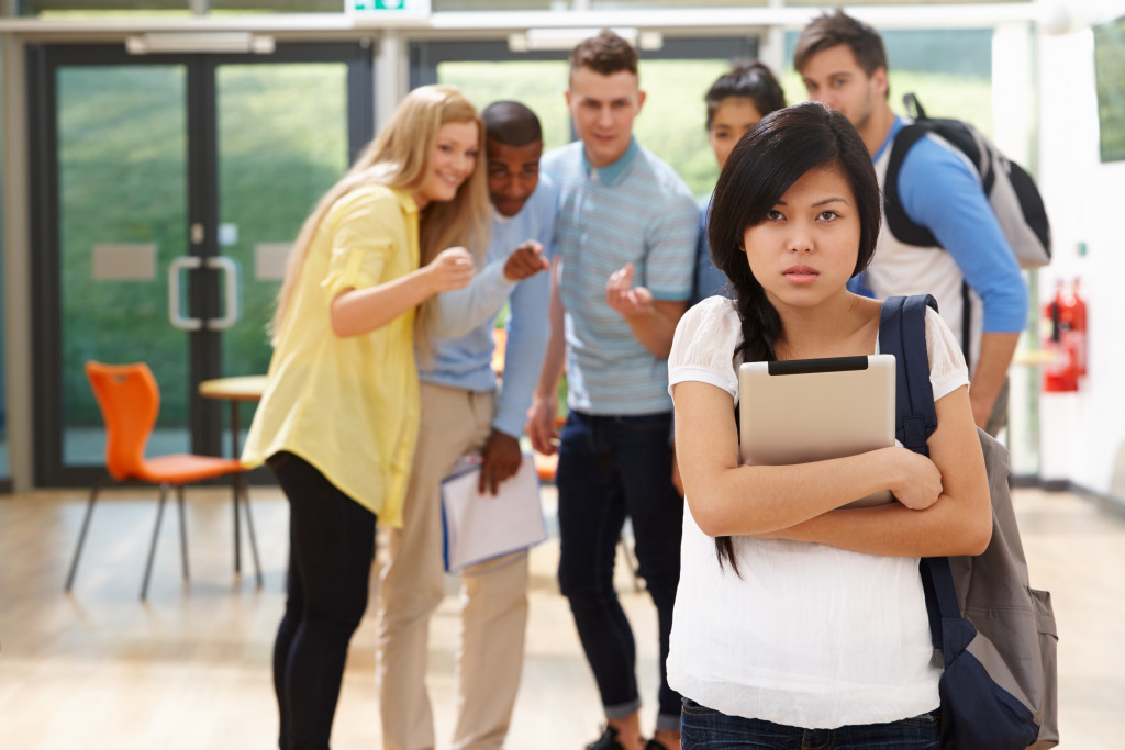 Female Student Being Bullied By Classmates