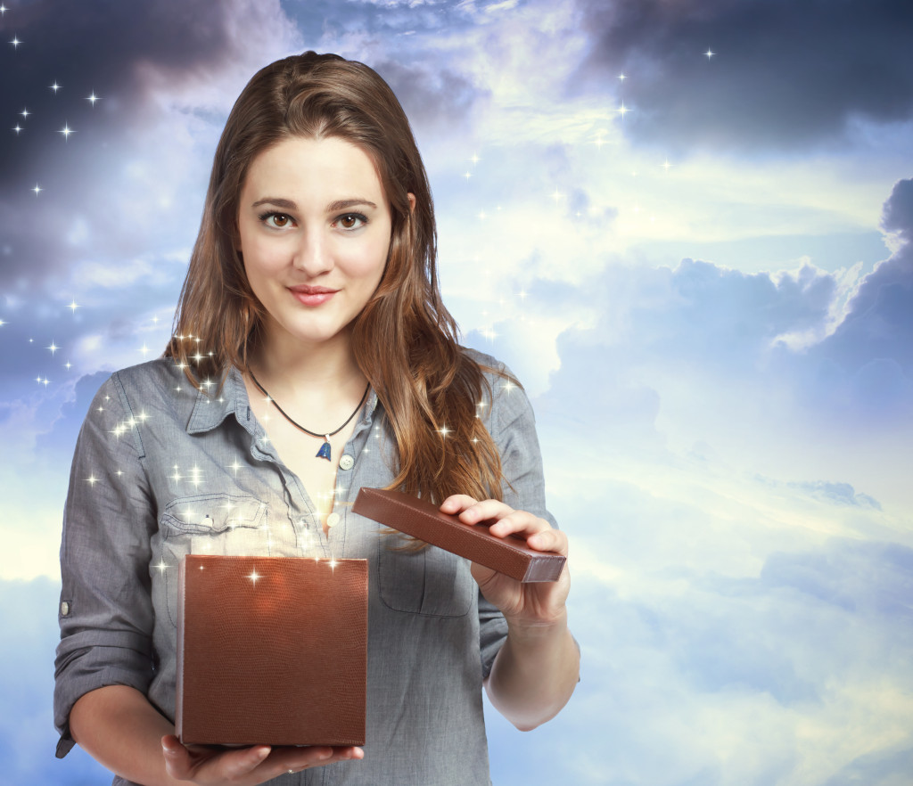 Beautiful Woman Opening a Gift Box